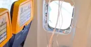 Panic on Ryanair Flight as Passenger Partially Sucked Out of Window