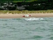 Person clings to cool box for hours after boat capsizes off North Wales