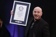 Pitbull Sets Guinness World Record for Largest Bald Cap Gathering