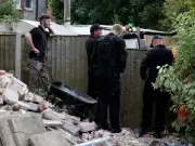 Police dig up garden in Salford, uncover deadly weapons stash
