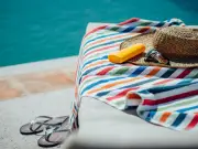 Pool Worker Becomes Holiday Hero by Removing Towels from Sunbeds in Greece