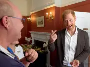 Prince Harry beams in behind-the-scenes photos from controversial UK visit