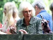 Queen Camilla Plays Poohsticks to Mark Winnie-the-Pooh Centenary