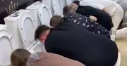 Russians Drink from Toilets in Bizarre Shopping Centre Game to Win £950
