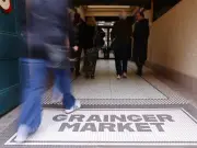 Tour Guide Urges Spending at Grainger Market After Fire