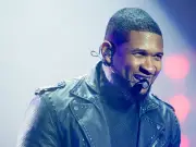 Usher removes fan from stage after awkward response to dance moves