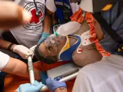 Venezuela quake survivor rescued from rubble after eight days