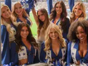 Victoria Beckham cracks smile with cheerleaders after 'grumpy' World Cup snap