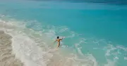 Woman strips to underwear to save 'drowning' man, only to find elite diver
