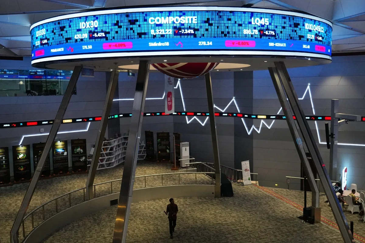 Asian shares mostly fall as gold jumps after Fed holds rates