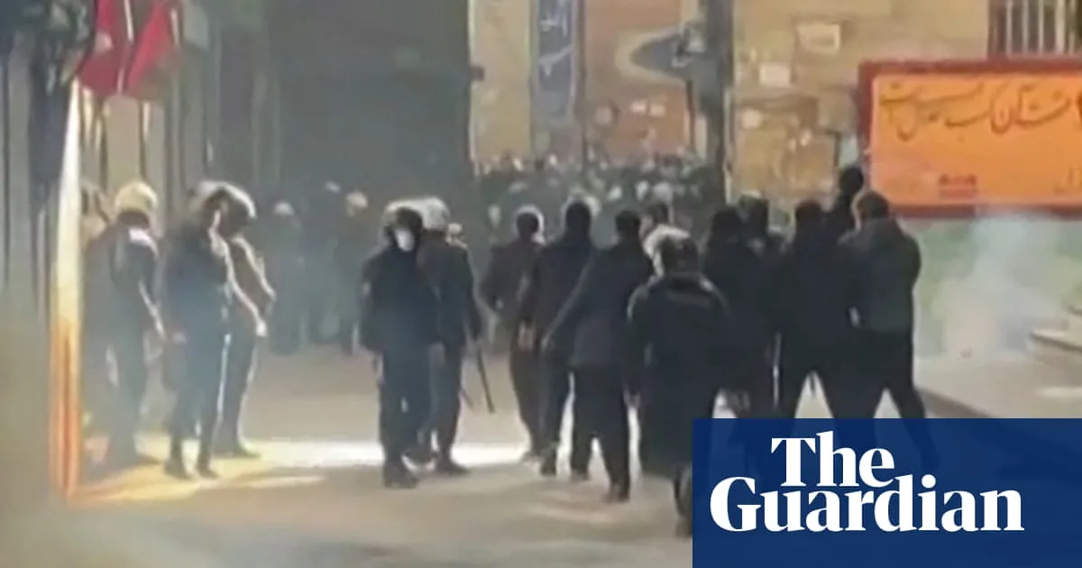 Iranian forces clash with protesters at Tehran bazaar as unrest enters 10th day