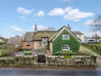 336-year-old Ivy Cottage in Saughall Massie on sale for £700k