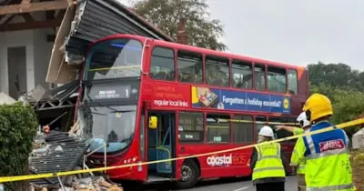 Bus crashes into Norfolk home as neighbour describes 'bomb' sound