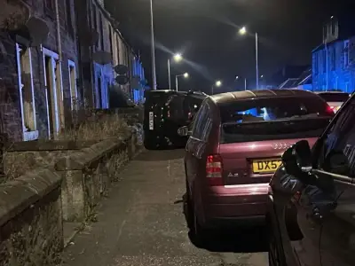 Car flipped on side after early hours crash near Scottish football stadium