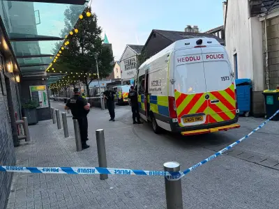 Cardiff stand off: Man on roof for hours as street closed
