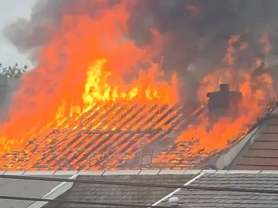 Fire tears through Ayrshire home as flames burst from roof
