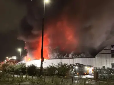 Huge fire rips through Salford shop on Bury New Road