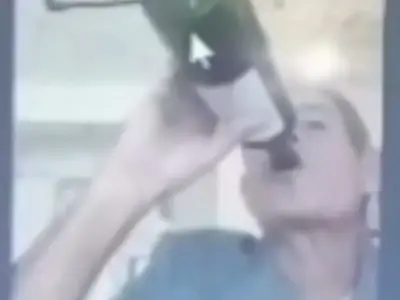 Judge drinks wine from bottle and lights cigarette with blowtorch in live hearing