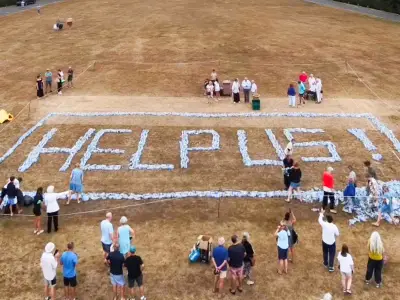 Kent villagers spell 'help us' with bottles in water protest