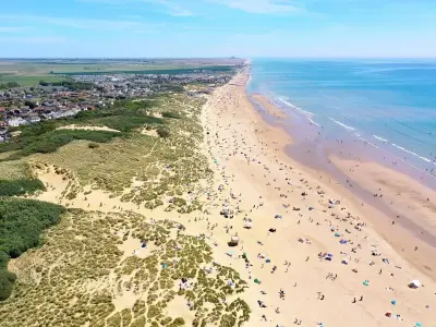 Man dies at Camber Sands as two escape water