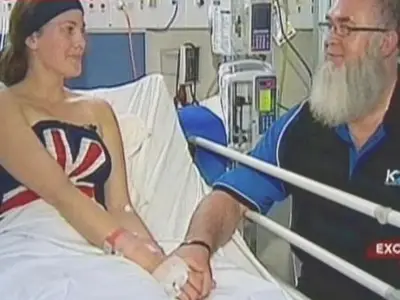 Man grabs 10ft shark by tail to save teen from attack