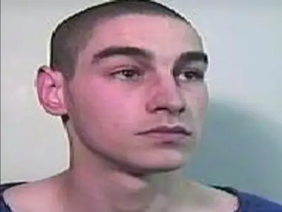 Murderer escaped prison over cell-sharing dispute