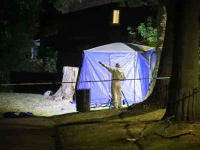 Police cordon and forensics tent in Levenshulme after major incident