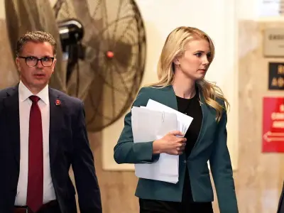 Trump 'hid with' pretty blonde aide, 34, over others during plane switch drama