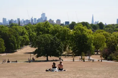 UK heatwave alert as temperatures near 32C and Scotland hit by rain