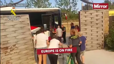 Wildfires rage near Athens as heatwave grips Europe