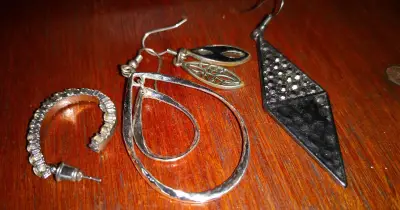 Woman dies after son allegedly rips earrings in attack