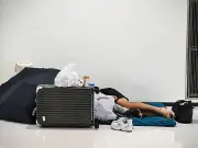 7,000 sleep in Japan airport as 'extremely unusual' rains strand thousands