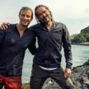 Bear Grylls defends baptising Russell Brand: 'My faith says we shouldn't judge'