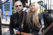 Brian Hyland performs outside Downing Street for NHS campaign