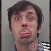 Bully who stuck tongue out for mugshot after strangling woman is jailed