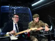 Burnham plays Smiths song with Ukrainian soldier on Kyiv visit