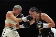 Cameron beats Mayer to unify titles in thriller