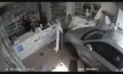 CCTV captures car smashing into pharmacy narrowly missing staff