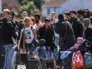 Channel Crisis: Children in Pushchairs Board Mega-Dinghies for UK