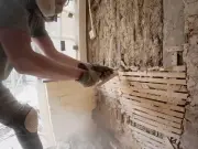 Couple's 'horror film' discovery behind kitchen cupboard wall