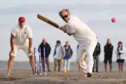 Cricketers bat on waterlogged pitch in annual Brambles match