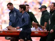 Crystal Palace's Chadi Riad Stretchered Off in Tears After Knee Injury