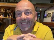 Dad in tears as he's charged with manslaughter over dog bite death