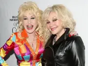 Dolly Parton offered to try experimental drugs in cancer battle, sister says