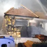 Fire destroys house and car in New Malden, London