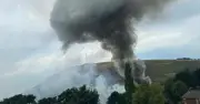 Fire erupts at industrial building near Tesco in Oldham village