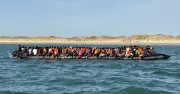 France warns no limit to migrants on boats to UK after record 230