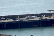 Government condemns smugglers after record 230 migrants in single boat