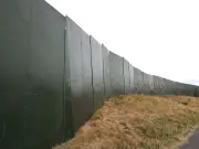 Green walls surround Liverpool park ahead of No Art festival