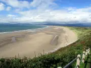 Harlech Beach: North Wales' Golden Sands with Castle Views